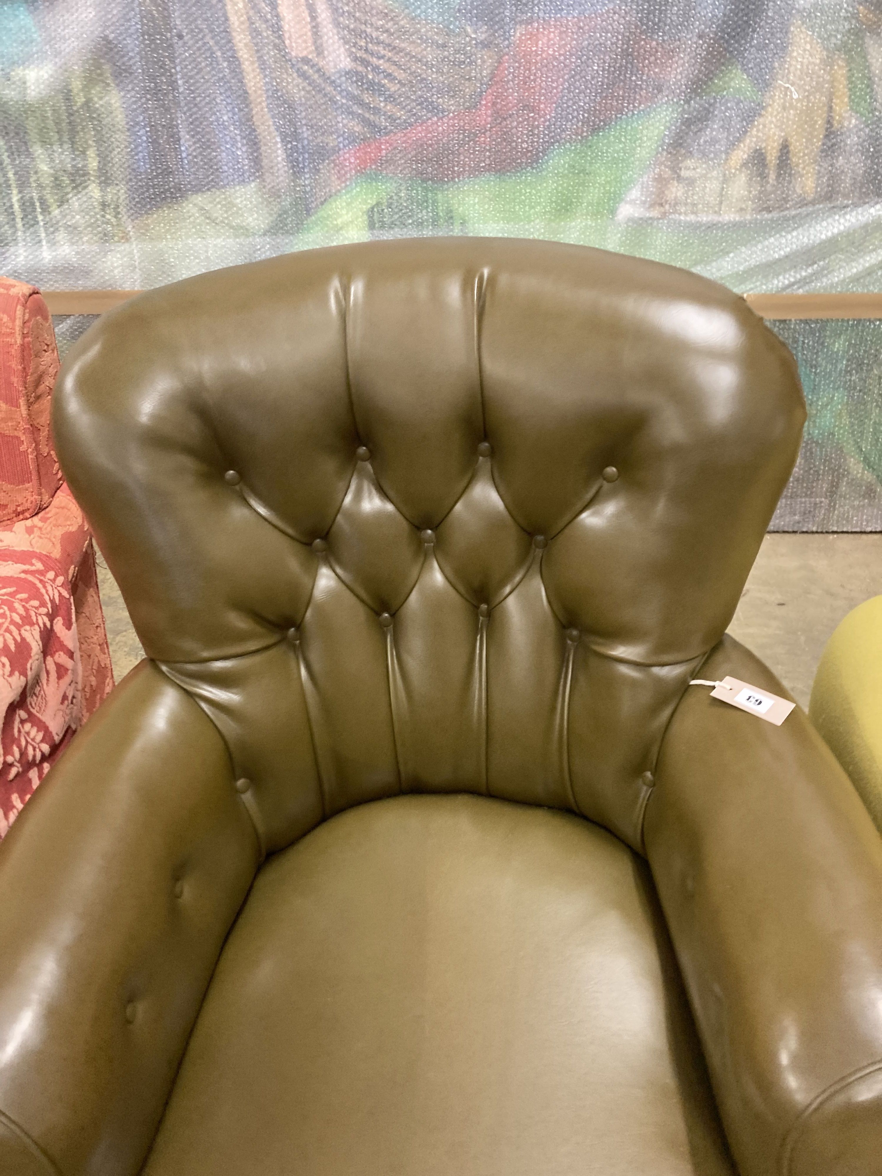 A Victorian library chair upholstered in olive green leather, width 80cm, depth 70cm, height 86cm